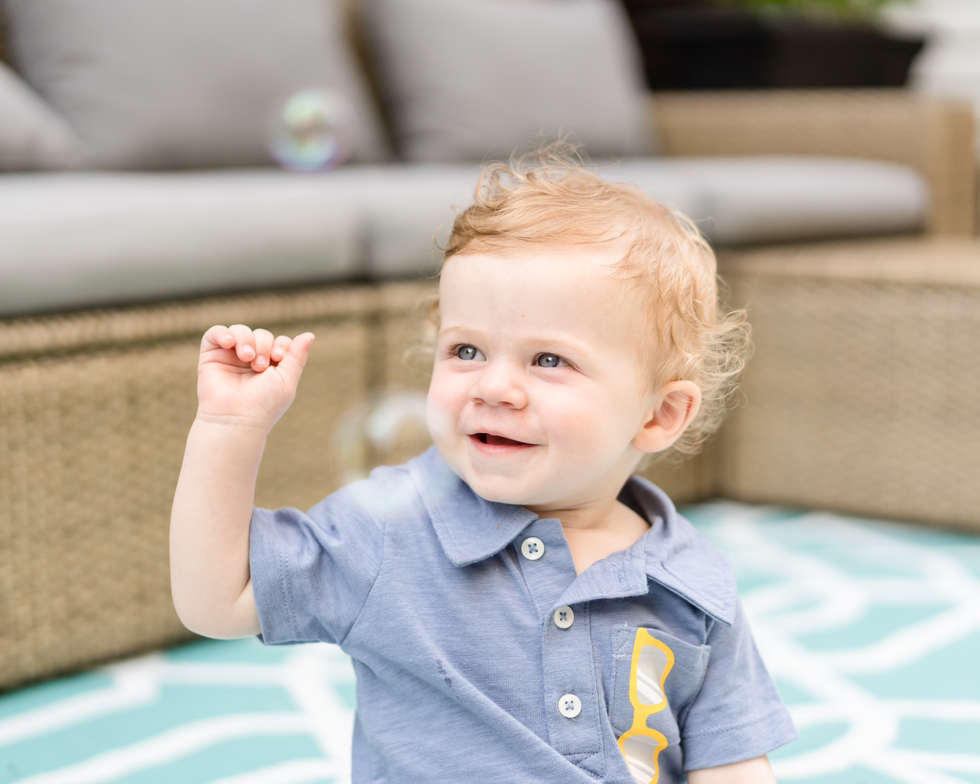 Portrait of a child playing with bubbles.